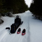 Man seated on snowmobile